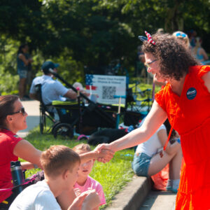 Amy Brooks shaking the hand of a constituent